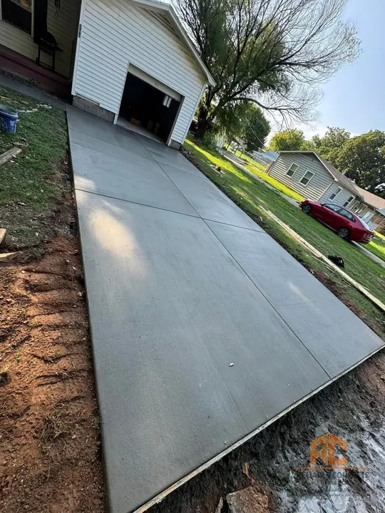 Long driveway leading up to a detached garage