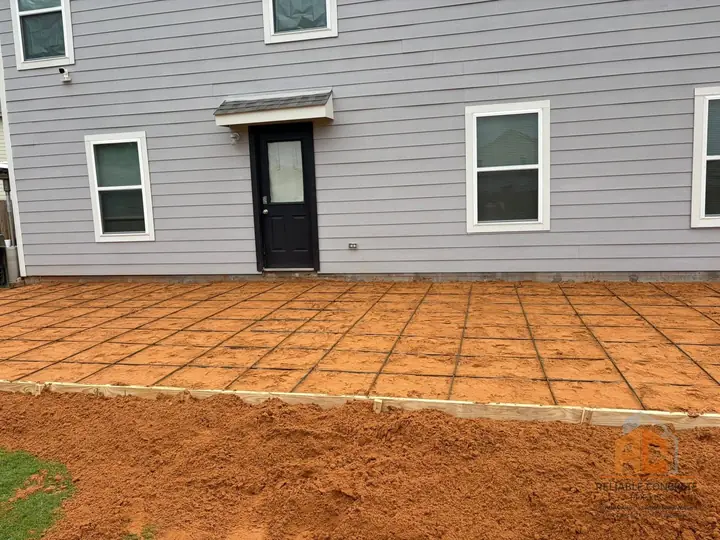 Patio forms set with a rebar grid on red East Texas soil