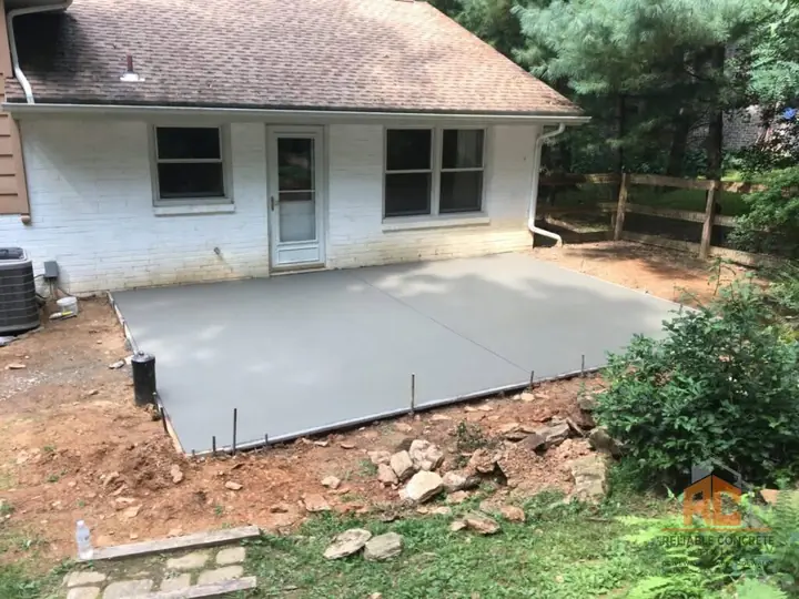 New back patio behind a white house