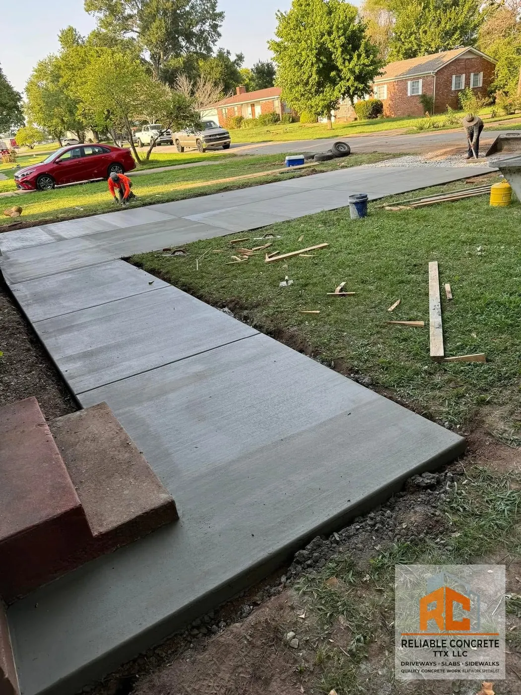 L-shaped front walkway joining a driveway