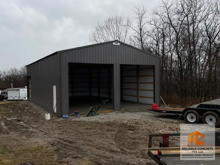 Metal shop building with a new concrete slab inside